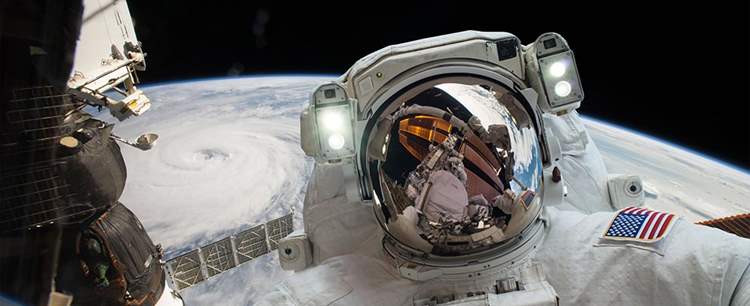 an image of an astronaut in space discussing Apollo Astronauts’ Fascinating Insurance Covers