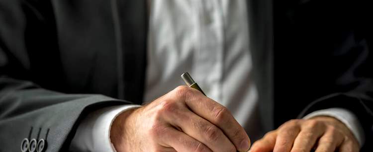 an image of person in a suit calculating the autumn statement and what it means for his buisness