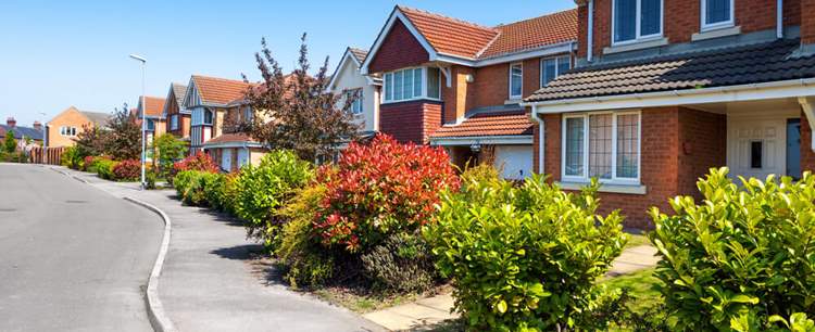 an image of a row of houses discussing Benefits of mortgage overpayments