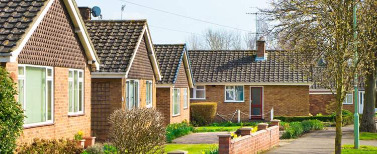 an image of a row of bungalows discussing how Bungalows all the rage