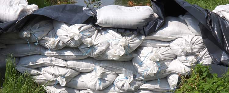 an image of sand bags illustrating being prepared for floods