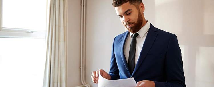 man reading about mortgage lending