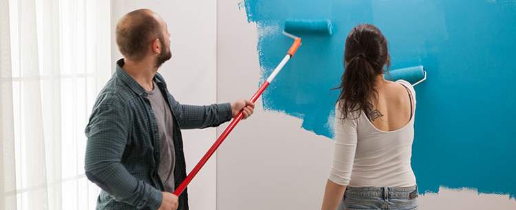 Couple painting walls