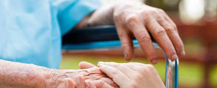 Two people holding hands