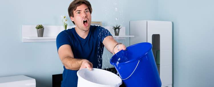 Man showing how to minimise escape of water claims in flats