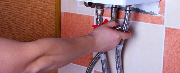 Landlords fixing a boiler in the winter