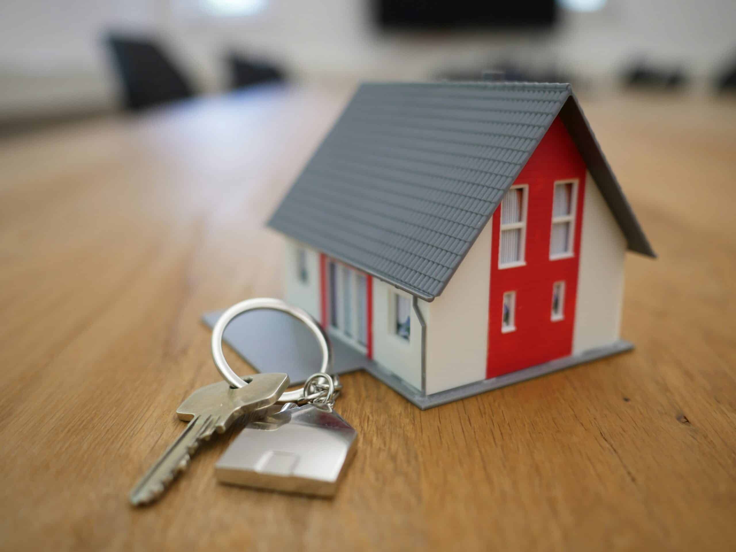 A house with a key on a table